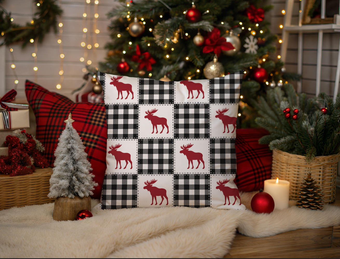 Decorative pillow with moose pattern in front of a Christmas tree