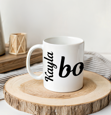 White mug with 'Kayla' and bonjour text on a wooden coaster