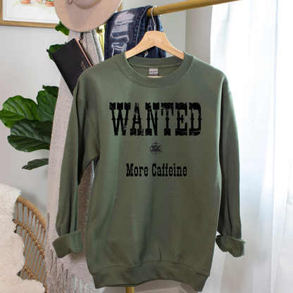 Green sweatshirt with 'WANTED More Caffeine' text on a hanger.